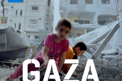 A young girl is shown picking herself up from the the rubble in front of a destroyed building with the text "Gaza: One year later."